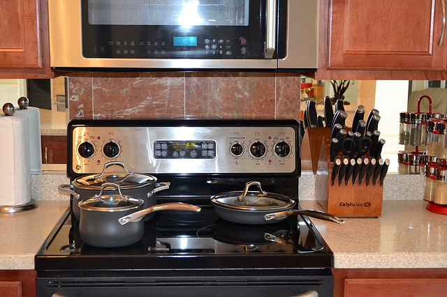 an electric range being used on a kitchen